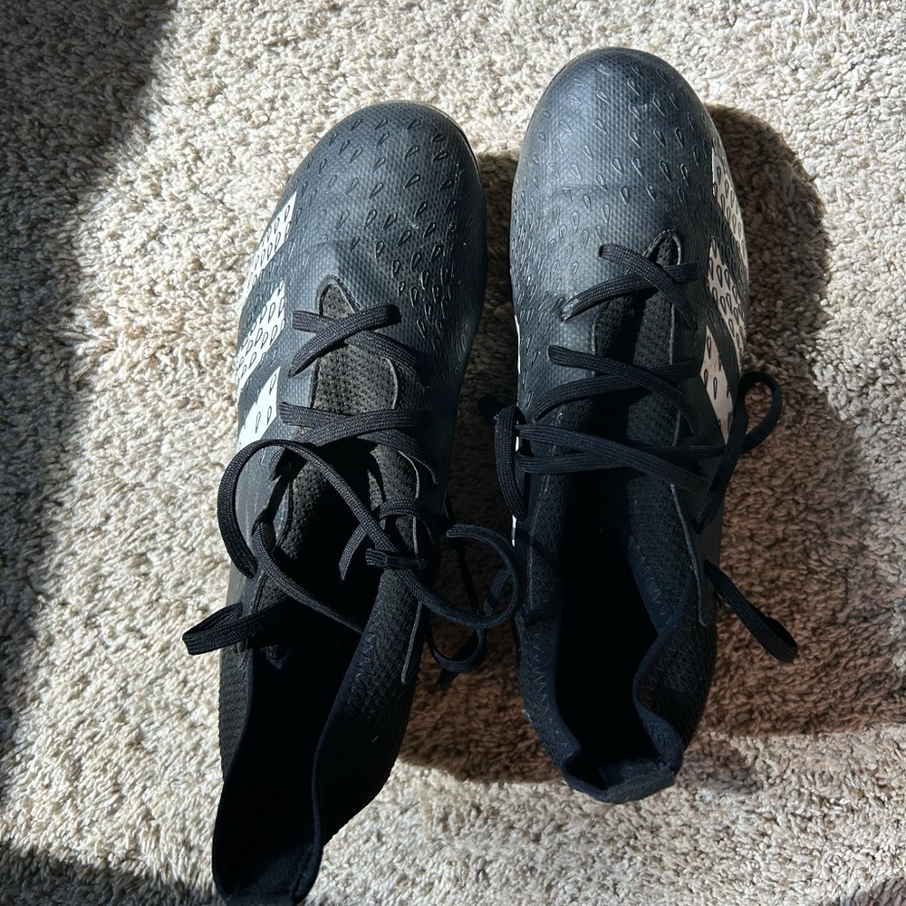 Black Adidas Demonscale soccer cleats, size 4.5 Kids